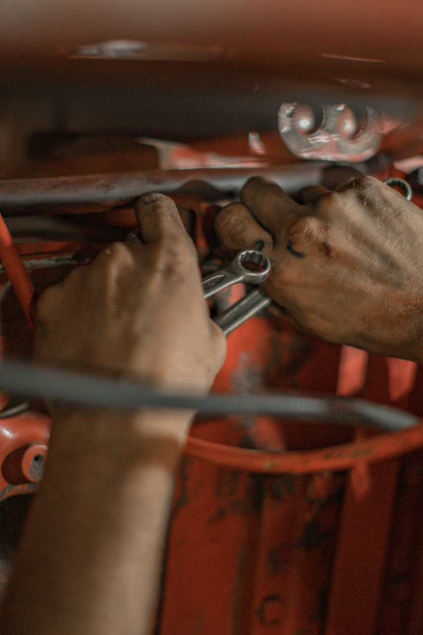 person holding red metal frame